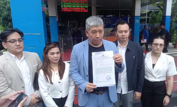 Pengacara Andreas SH, MH usai membuat laporan. (Foto: PMJ/Gtg).