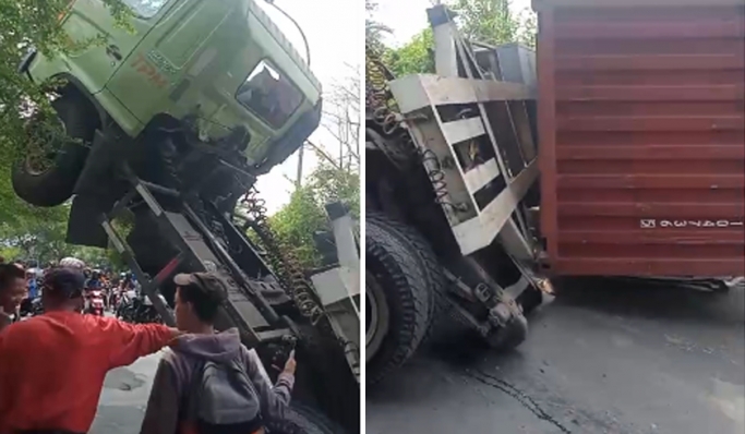 Truk kontainer yang tidak kuat menanjak terbalik dan menimpa mobil Hyundai di Jalan Kamal Muara Raya, Penjaringan, Jakarta Utara. (Foto: PMJ News/Tangkapan Layar)